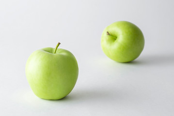 Fresh juicy green apples on white background