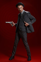 private detective holding gun