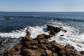 waves breaking on rocks