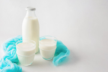 Homemade kefir or yogurt with probiotics on a white background with copy space.