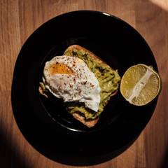 Poached egg with avocado cream on toast