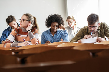 In the university classroom, students sit with focused determination, taking a test that challenges...