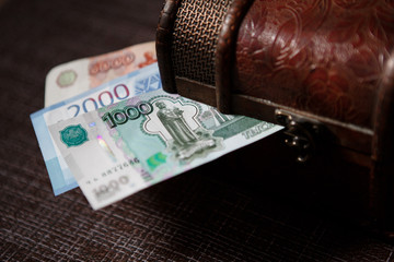 Russian banknotes 1000, 2000, 5000 rubles are in the trunk. Financial concept of household finances of Russians.