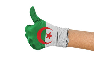 Algeria flag on a hand glove showing thumbs up sign