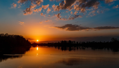 Beautiful sunset with reflections near Ettling, Isar, Bavaria, Germany
