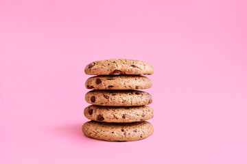 Oat cookie Front view photo in minimal style Cookies with chocolate chip on a pink background