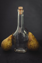 Two pears together and a liquor bottle - vintage
