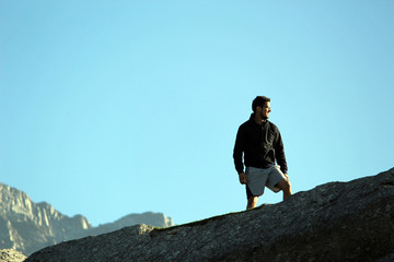 man on the top of the mountain