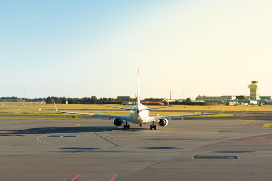 An Airplane Seen From Behind On The Runway Ready To Take Off