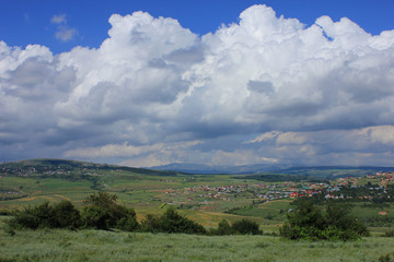 Obraz premium Azerbaijan. Cumulus clouds above ground