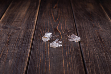 A lan connector close up in wooden background. Copy space. Space for text.