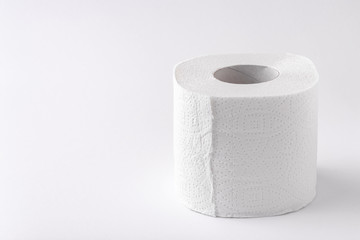A roll of toilet paper on a white background. Copy space. Space for text.