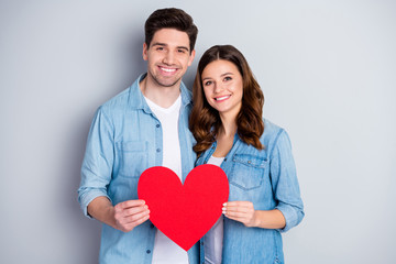 Photo attractive charming lady handsome guy demonstrating per paper heart figure big postcard symbolizing love wear casual denim shirts outfit isolated grey color background