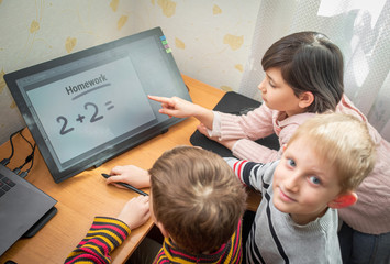 Cute children do homework at home.