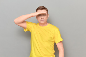Portrait of serious focused man gazing into the distance
