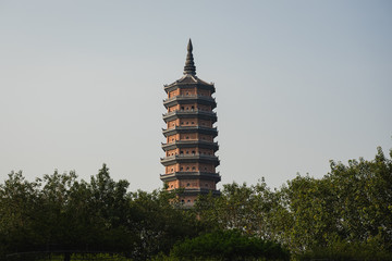 Bai dinh tower pagoda behind the trees