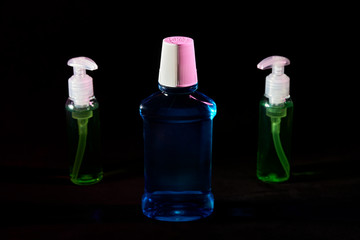 lot of sanitizer hand antiseptics. dark background