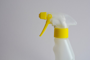 Spray bottle isolated on white with copy space