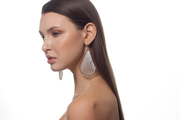 Fototapeta premium Close-up portrait of a beauty woman with full lips, straight hair and perfectly clean skin. Daytime makeup, styling and soft care. Skin care in the spa salon or cosmetology, smooth eyebrows