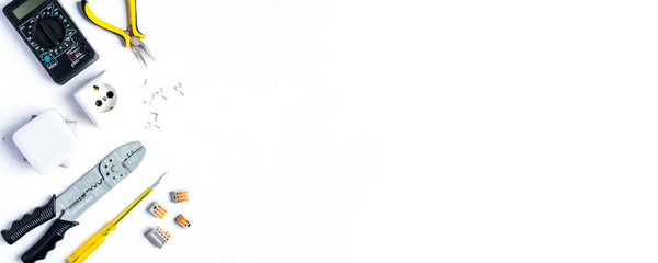 Tools for electrician on a white background. Flat lay and top view. Copy space for text