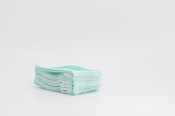Isolated New green Hygienic Mask on the white background in studio light.