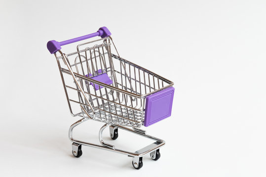 The shopping cart is empty. Purple elements. Concept.