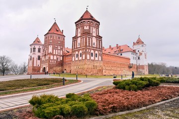 Fototapeta na wymiar Minsk, Belarus - March 2020. Beautiful medieval Mir castle. Famous landmark in Belarus. Red bricks old castle complex Mirsky zamok. UNESCO world heritage