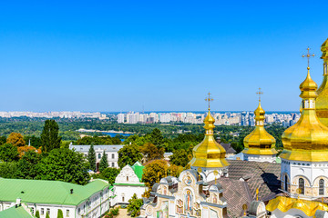 Fototapeta na wymiar View on Dormition Cathedral of the Kiev Pechersk Lavra, river Dnieper and Kiev cityscape