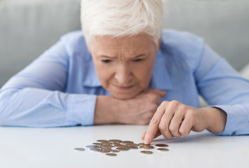 Coronacrisis And Financial Problems. Senior Woman Counting Remaining Coins, Suffering From Poverty - obrazy, fototapety, plakaty