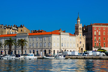 Church in Split's marina in Croatia - Reflection of old buildings in the waters of the Adriatic Sea in the urban harbor of this European city