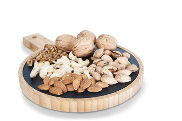 Different nuts isolated on white. Walnuts, almonds, cashews.