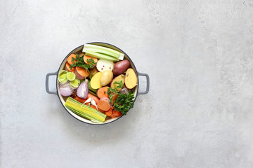 Ingredients for vegetable broth, vegetables, herbs, spices.