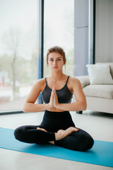 young woman doing yoga. yoga at home. meditation at home. 