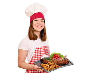 happy girl cook with pork spare ribs at plate