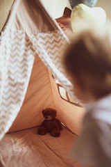 Children's wigwam for a beige boy. In the nursery. © Дмитрий Чапурин