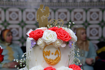 Wedding cake iced and decorated.