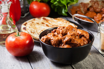 Chicken tikka masala served with bread naan