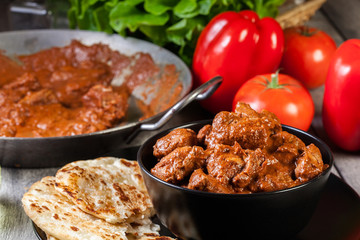 Chicken tikka masala served with bread naan