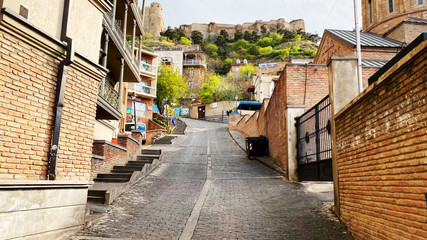 TBILISI, GEORGIA  APRIL 19 , 2020:  Old Tbilisi architecture, Cobbled streets  in Tbilisi, Georgia