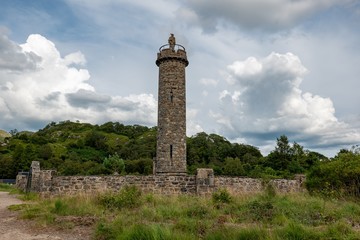 Glenfinnan Monument from beginning of the 19th century with a statue of anonymous highlander in...