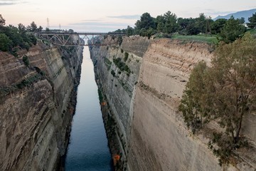 Famous Corinth Canal in Greece making a passageway for ships and vessels after sunset