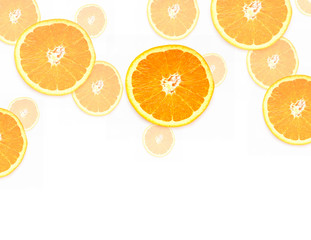 Sliced ​​Orange. Slices of fruits of different sizes on a white background.