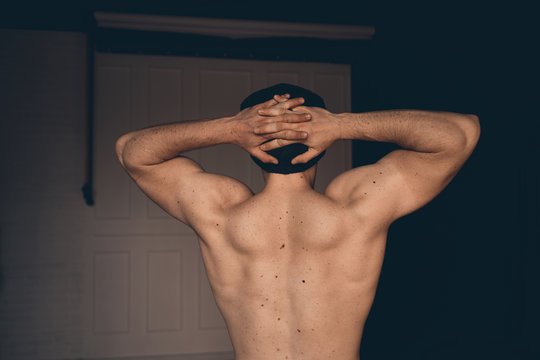 athletic man, view from the back. textured muscles