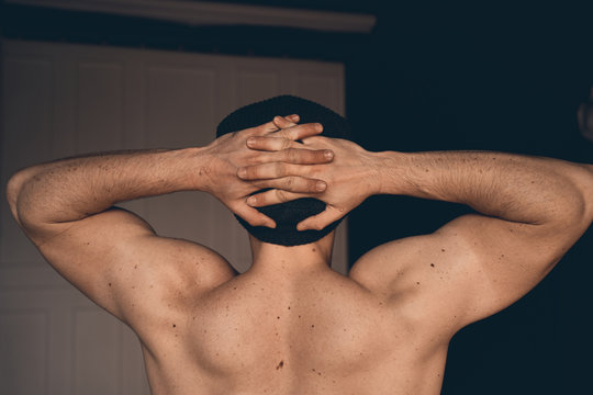 athletic man, view from the back. textured muscles