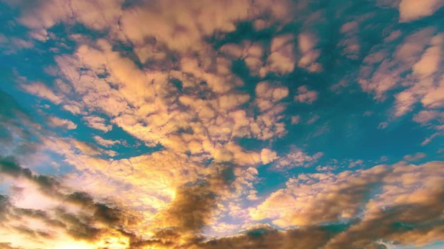 Timelapse of beautiful dramatic sunset with dramatic sky and colorful fluffy clouds. 4K time lapse