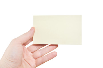 Hand holding a yellow card isolated on white background. Close up