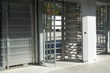 entrance to a closed area, turnstile to a sports facility or attraction , street turnstile, checkpoint, attraction checkpoint