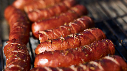 Beautifully browned sausages on a wood grill until you feel like eating them
