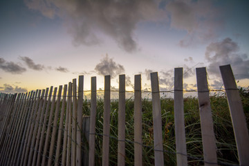 Beautiful Sunset with Beach Fence