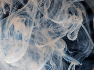 Mixing Dettol antiseptic liquid with water. Creates abstract cloud type patterns, swirls and turns white. Dettol helps kill viruses, bacteria and germs around the home. Coronavirus protection.